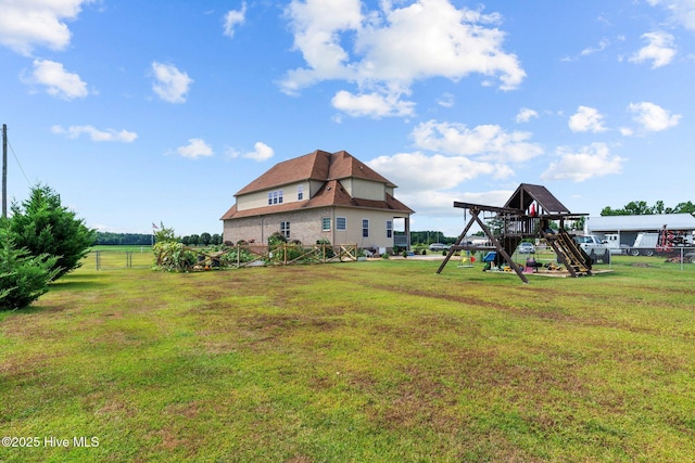 view of yard with a playground and fence