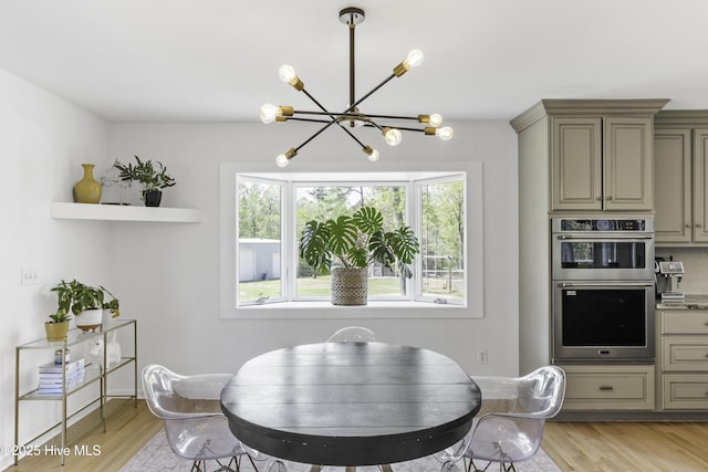 8050 Rachel Wynd Rd NE, Leland, NC 28451 - dining area with a notable chandelier and light wood-type flooring