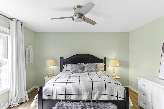 8050 Rachel Wynd Rd NE, Leland, NC 28451 - bedroom with baseboards, ceiling fan, and light wood-type flooring