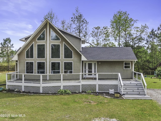 8050 Rachel Wynd Rd NE, Leland, NC 28451 - rear view of property with a wooden deck, a shingled roof, and a yard
