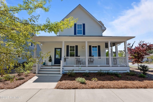 15 Station Ave, Southern Pines, NC 28387 - farmhouse-style home with a porch