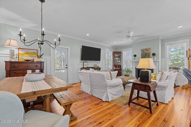 15 Station Ave, Southern Pines, NC 28387 - living area featuring a decorative wall, light wood-type flooring, and ornamental molding