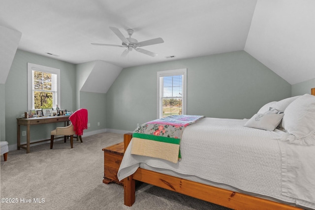 15 Station Ave, Southern Pines, NC 28387 - carpeted bedroom with visible vents, multiple windows, vaulted ceiling, and ceiling fan