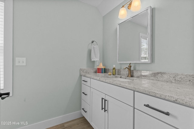 15 Station Ave, Southern Pines, NC 28387 - bathroom featuring vanity, baseboards, and wood finished floors