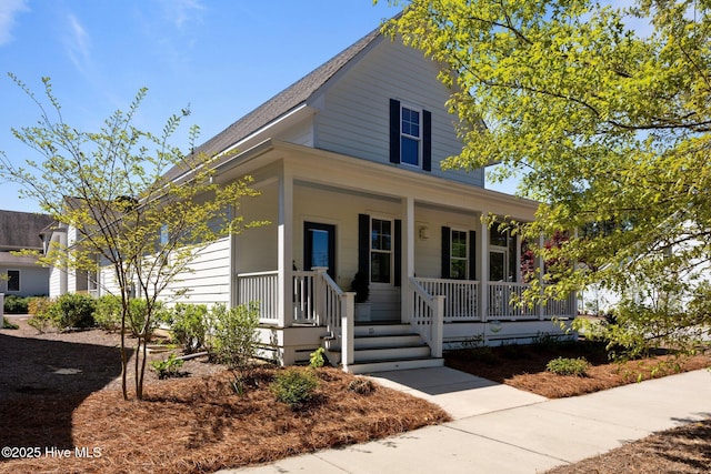 15 Station Ave, Southern Pines, NC 28387 - view of front facade featuring a porch and roof with shingles