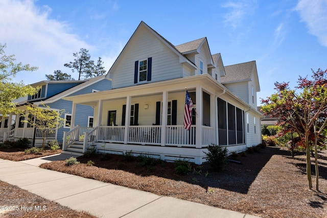 15 Station Ave, Southern Pines, NC 28387 - farmhouse-style home with a porch