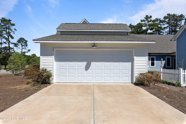 15 Station Ave, Southern Pines, NC 28387 - garage with fence and concrete driveway