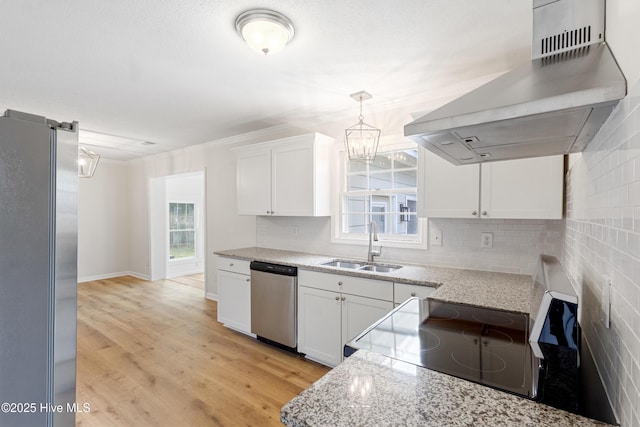 132 Elder Dr, Wilmington, NC 28405 - kitchen featuring stainless steel appliances, ventilation hood, white cabinetry, backsplash, and ornamental molding