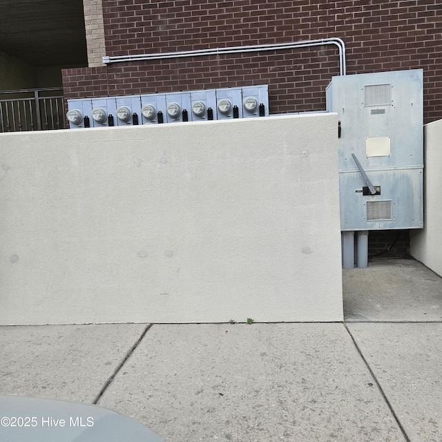 exterior details with electric meter and brick siding