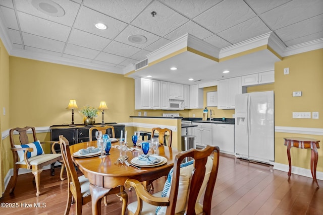 106 N Water Street 205 & 206, Wilmington, NC 28401 - dining room featuring ornamental molding, baseboards, dark wood-type flooring, and visible vents