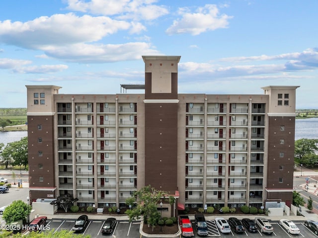 106 N Water Street 205 & 206, Wilmington, NC 28401 - view of building exterior featuring uncovered parking and a water view