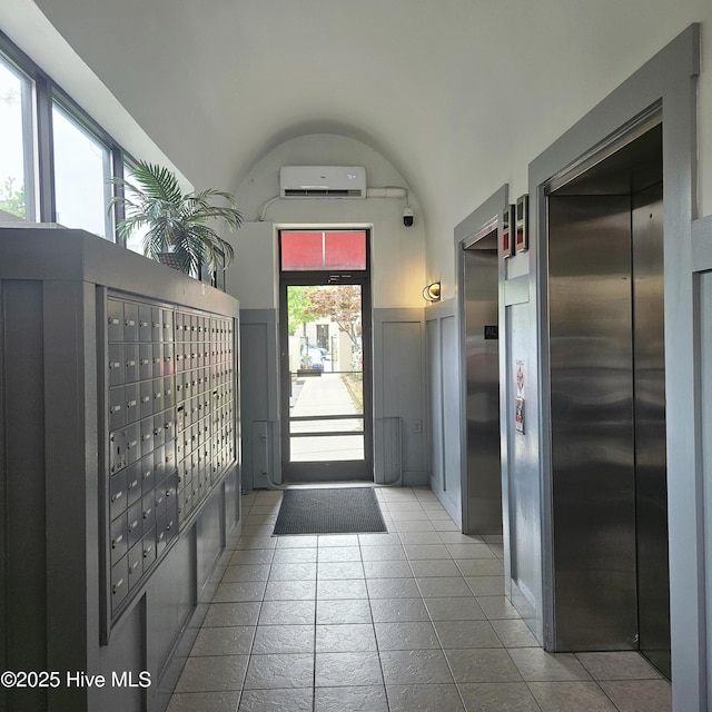 106 N Water Street 205 & 206, Wilmington, NC 28401 - interior space featuring tile patterned floors, elevator, a wall mounted AC, and mail area