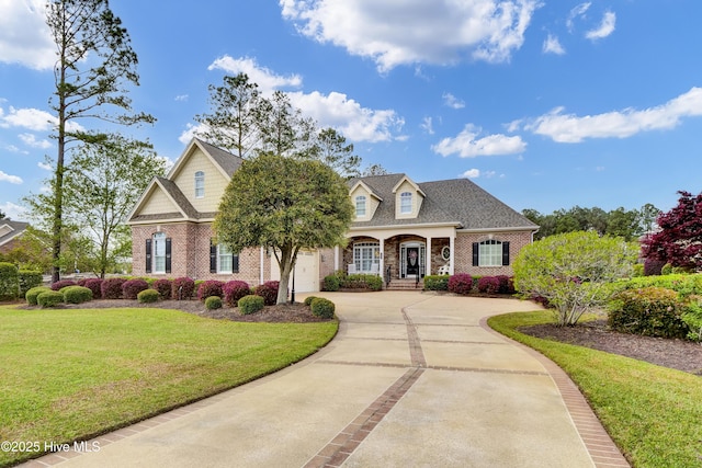 9278 Checkerberry Sq NW, Calabash, NC 28467 - traditional-style house featuring brick siding, concrete driveway, and a front lawn