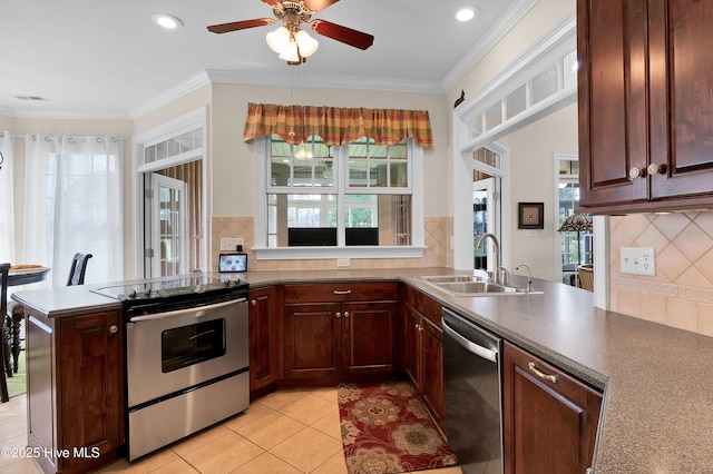 9278 Checkerberry Sq NW, Calabash, NC 28467 - kitchen featuring stainless steel appliances, tasteful backsplash, a ceiling fan, light tile patterned floors, and ornamental molding