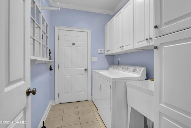 9278 Checkerberry Sq NW, Calabash, NC 28467 - laundry room featuring washing machine and dryer, cabinet space, light tile patterned floors, and crown molding