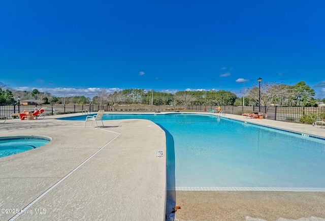 9278 Checkerberry Sq NW, Calabash, NC 28467 - community pool with a patio