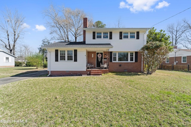 722 Christine Ave, Jacksonville, NC 28540 - traditional-style home featuring fence, crawl space, aphalt driveway, a front lawn, and a chimney