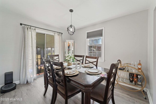 722 Christine Ave, Jacksonville, NC 28540 - dining room with baseboards and light wood-style floors