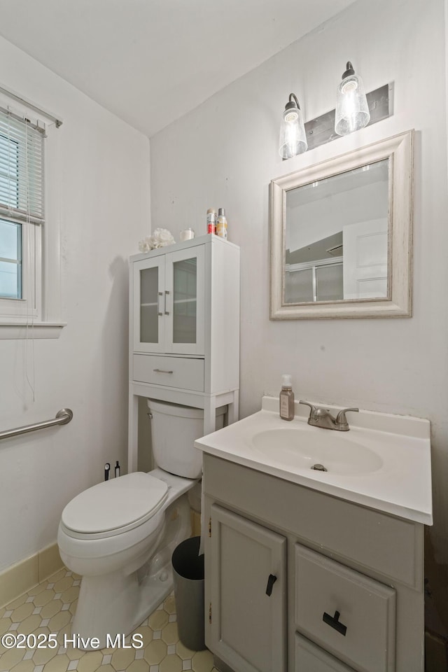 722 Christine Ave, Jacksonville, NC 28540 - bathroom with toilet, vanity, tile patterned flooring, and baseboards