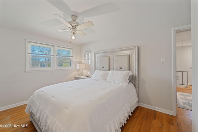 722 Christine Ave, Jacksonville, NC 28540 - bedroom featuring baseboards, wood finished floors, and a ceiling fan