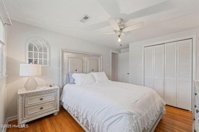 722 Christine Ave, Jacksonville, NC 28540 - bedroom with light wood finished floors, visible vents, a closet, and a ceiling fan