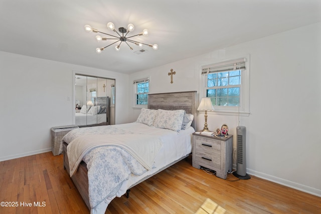 722 Christine Ave, Jacksonville, NC 28540 - bedroom with a notable chandelier, a closet, light wood finished floors, baseboards, and visible vents