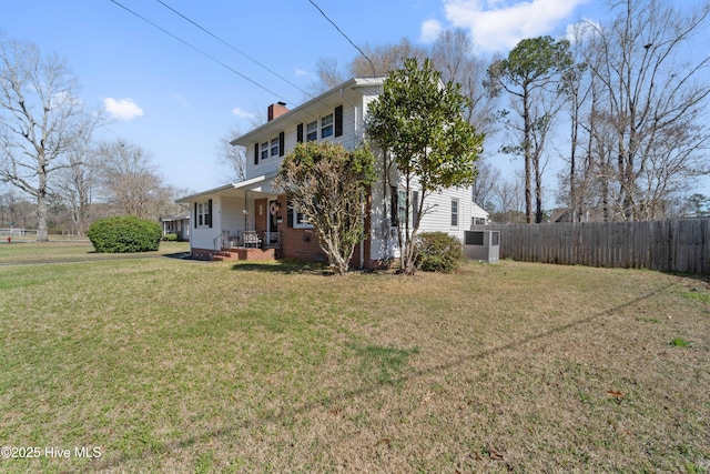 722 Christine Ave, Jacksonville, NC 28540 - exterior space with a chimney, fence, brick siding, and a yard