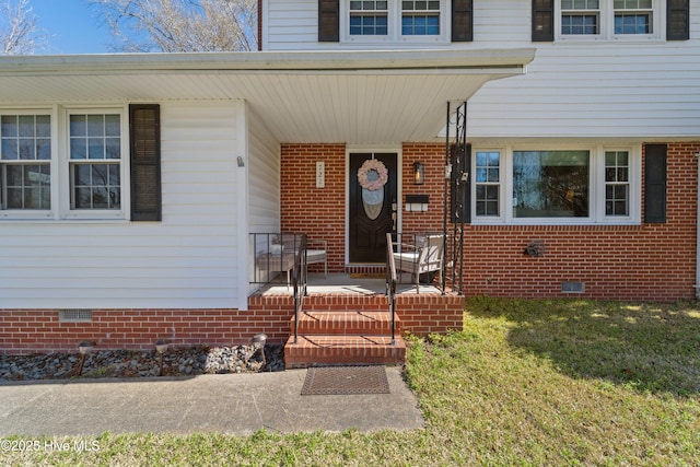 722 Christine Ave, Jacksonville, NC 28540 - view of exterior entry featuring a lawn, covered porch, and crawl space