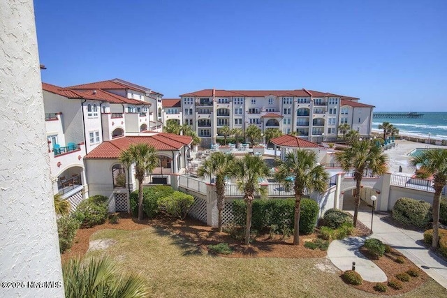 790 New River Inlet Rd Unit 208B, North Topsail Beach, NC 28460 - view of building exterior featuring a water view and fence