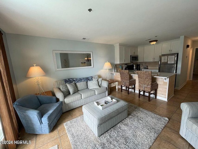 790 New River Inlet Rd Unit 208B, North Topsail Beach, NC 28460 - living area with light tile patterned flooring and visible vents