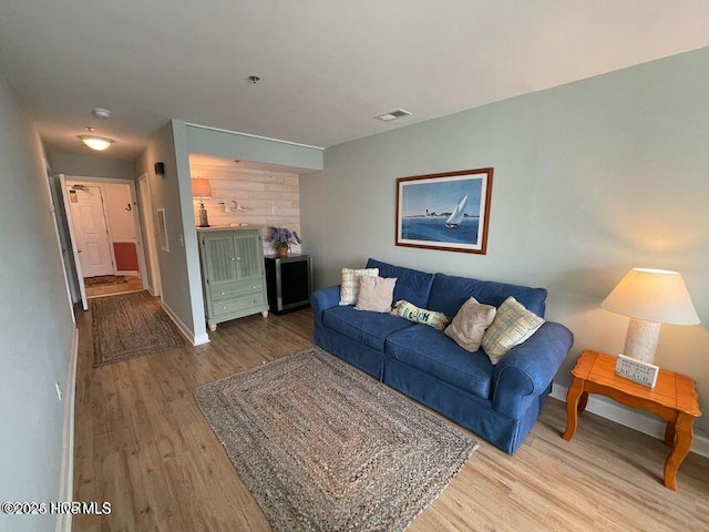 790 New River Inlet Rd Unit 208B, North Topsail Beach, NC 28460 - living area featuring baseboards, visible vents, and wood finished floors