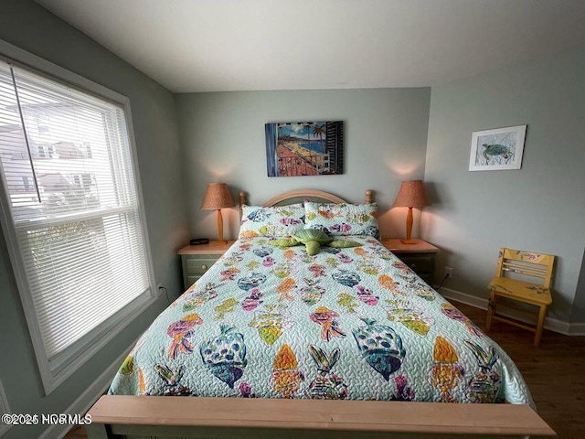 790 New River Inlet Rd Unit 208B, North Topsail Beach, NC 28460 - bedroom with baseboards and wood finished floors