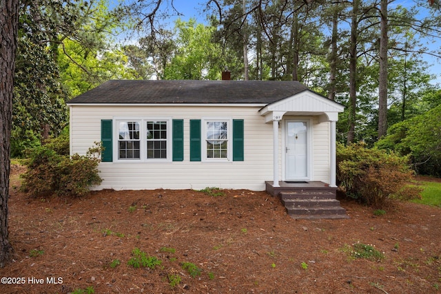 705 W Main St, Conway, NC 27820 - view of front of house with roof with shingles and a chimney