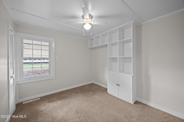 705 W Main St, Conway, NC 27820 - unfurnished bedroom with carpet, crown molding, baseboards, and a ceiling fan