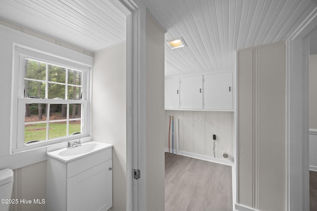 705 W Main St, Conway, NC 27820 - bathroom with healthy amount of natural light, wood finished floors, wood ceiling, vanity, and toilet