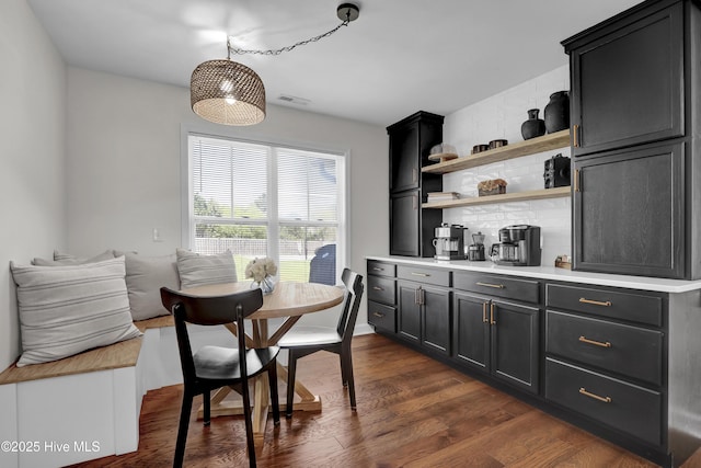 dining space with dark wood finished floors