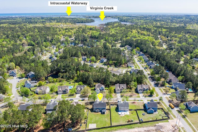 bird's eye view featuring a water view, a residential view, and a forest view
