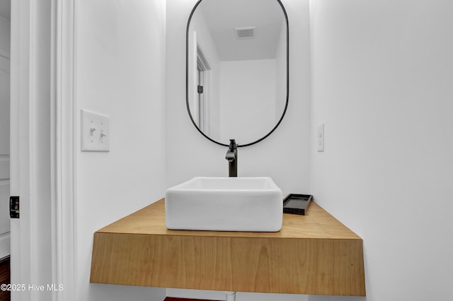 bathroom with vanity and visible vents