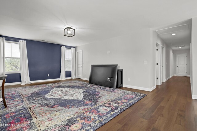 interior space featuring visible vents, baseboards, and wood finished floors