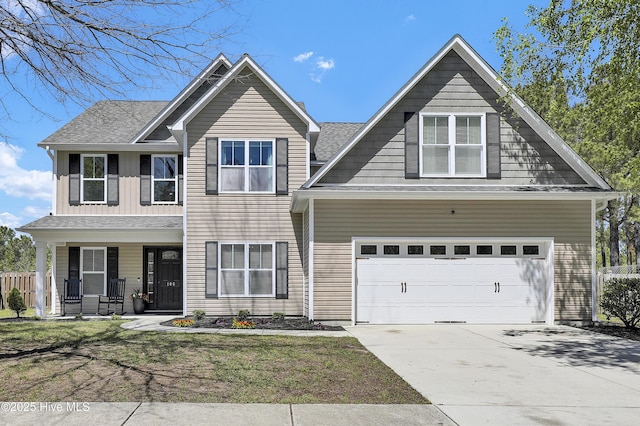 traditional home with a porch, a shingled roof, and concrete driveway
