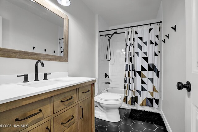 full bathroom with toilet, shower / bath combo, vanity, and tile patterned floors
