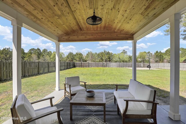 view of patio / terrace with a fenced backyard and an outdoor living space