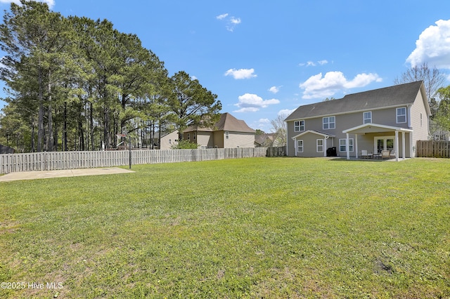 view of yard with a patio and a fenced backyard