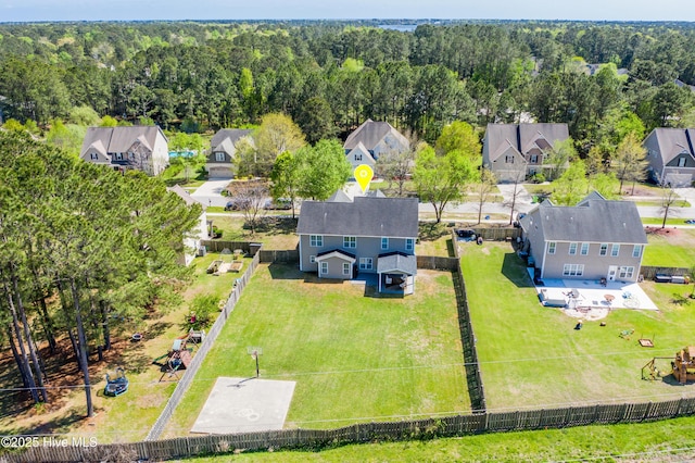 aerial view with a wooded view