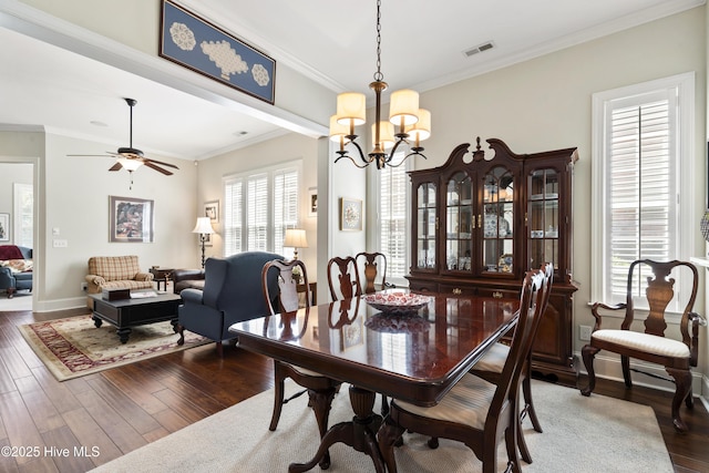 1502 Crows Landing Cir, Wilmington, NC 28403 - dining area featuring wood finished floors, a chandelier, crown molding, baseboards, and a ceiling fan
