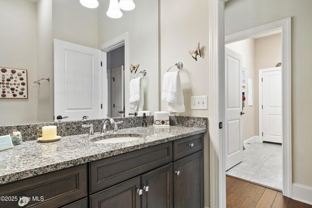 1502 Crows Landing Cir, Wilmington, NC 28403 - bathroom with vanity, wood finished floors, and baseboards