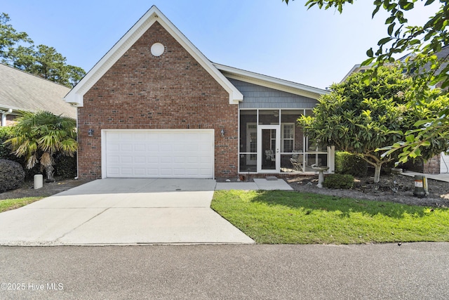 1502 Crows Landing Cir, Wilmington, NC 28403 - ranch-style home with a sunroom, driveway, brick siding, and a front yard