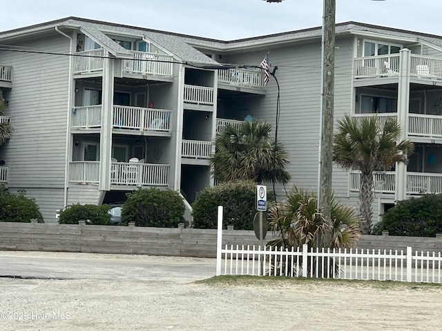 view of property featuring fence