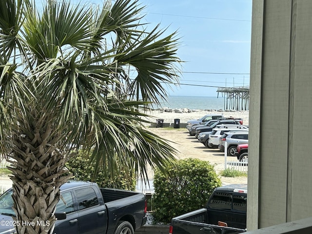 uncovered parking lot with a water view