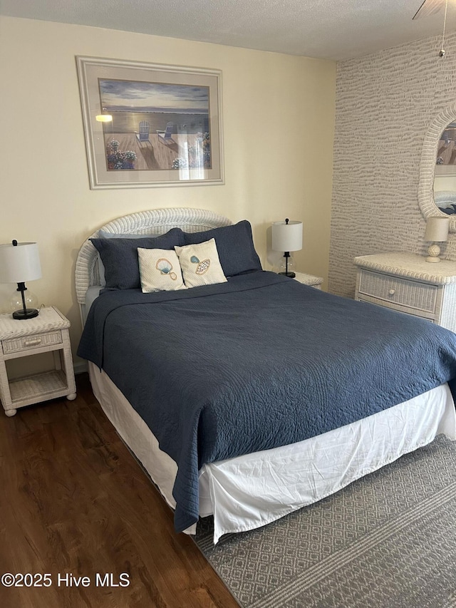 bedroom with dark wood-style floors